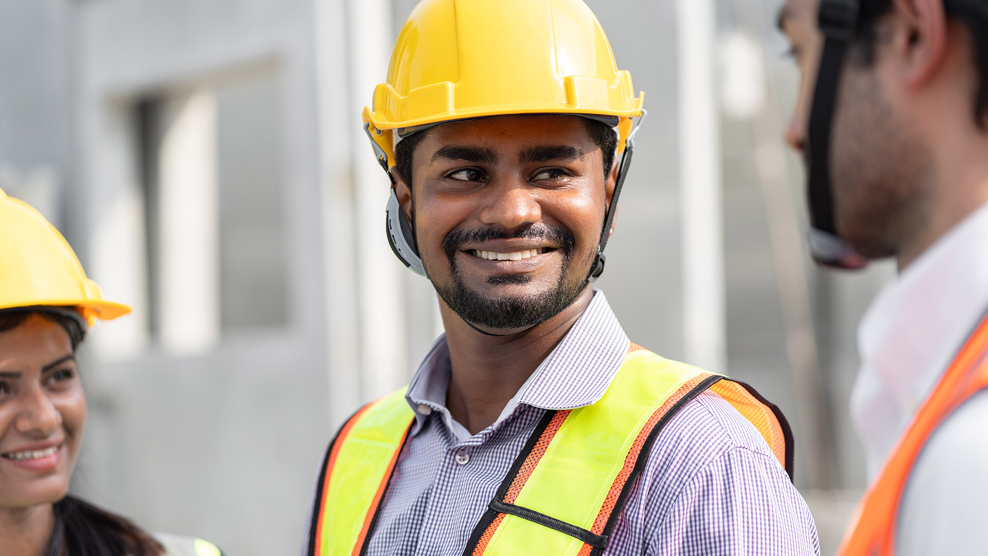 Indian engineer wearing safety helmet